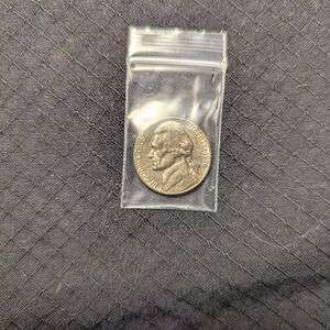 Vintage Nickel Coin in Protective Sleeve